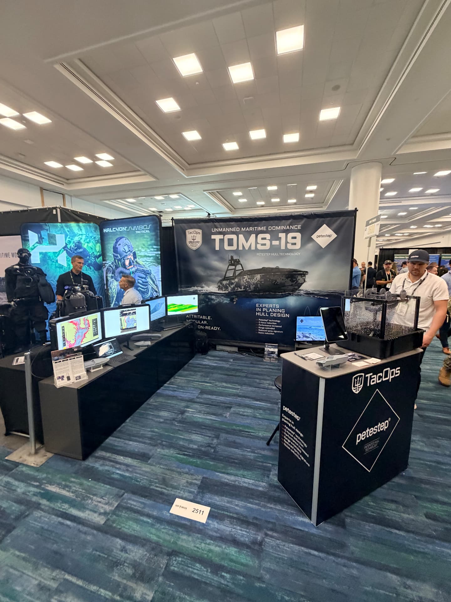 TacOps booth in the Maritime Section at SOF Week 2026 in Tampa, with TOMS-19 displays and operator workstations
